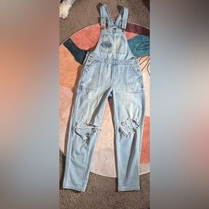 Distressed light denim overalls